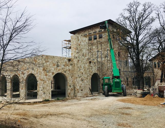 This was a very difficult stone veneer construction. The trickiest part was the scaffolding of the tower. The use of the skytrack made things much easier. This stone had a very Italian look to it, which was what the homeowner was going for.