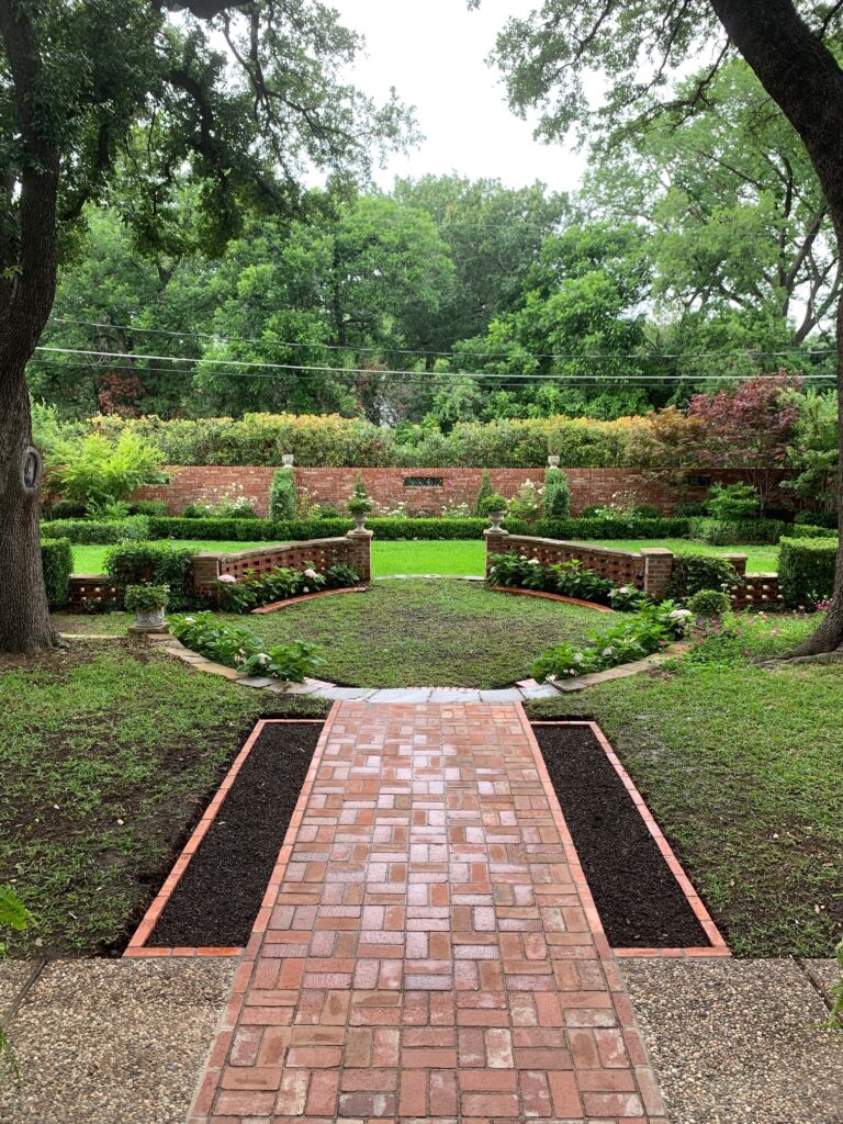 This walkway was designed by it's owner, who is an architect. His design was beautiful and made my job much easier. He suggested a basket weave pattern with an adjacent flowerbed. The joints were filled with a polymeric sand which prevents weeds and wash out of the mortar joints. Reclaimed brick pavers have some of the most beautiful aesthetics of all hardscaping materials.