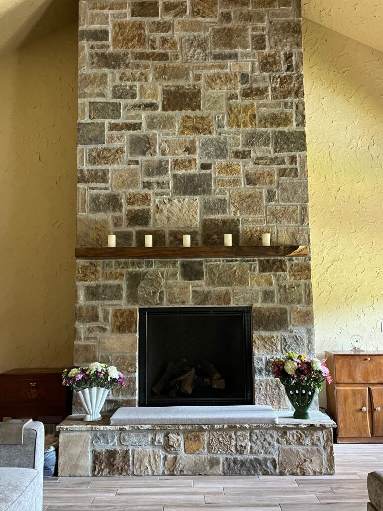 This fireplace was built in a home that we also put stone on the façade. It was a beautiful mix of sandstone and lime stone. The rocks were chopped at the quarry, but we still had to shape them on site. Notice the beautiful ashlar pattern with a flush face aesthetic.